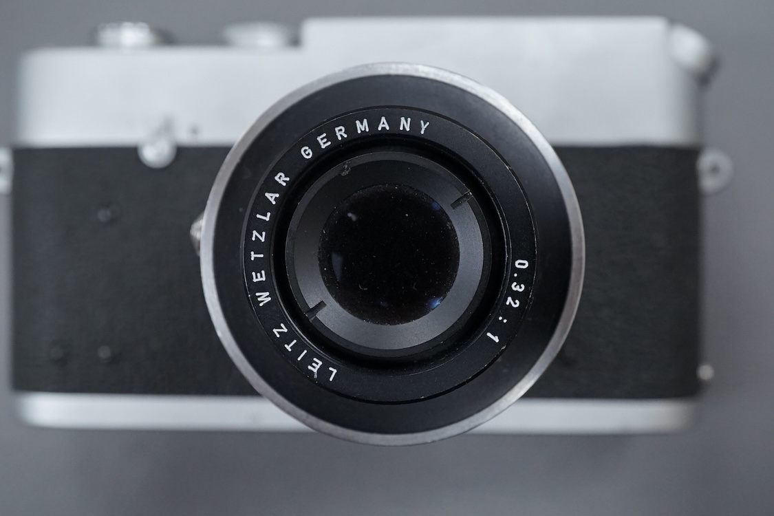 A Leica M Series MDa camera, with a Leitz 0.32:1 lens, the body stamped ‘1411519’